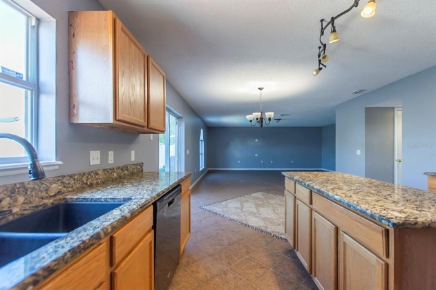 5821 WINDRIDGE DRIVE, WINTER HAVEN, Florida 33881, 5 Bedrooms Bedrooms, ,3 BathroomsBathrooms,Residential,For Sale,WINDRIDGE,O6007783