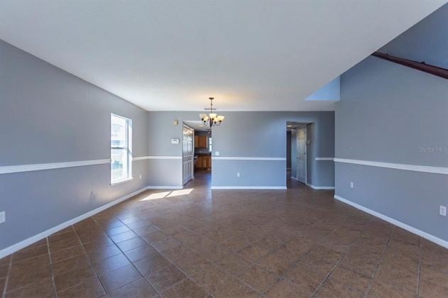 5821 WINDRIDGE DRIVE, WINTER HAVEN, Florida 33881, 5 Bedrooms Bedrooms, ,3 BathroomsBathrooms,Residential,For Sale,WINDRIDGE,O6007783