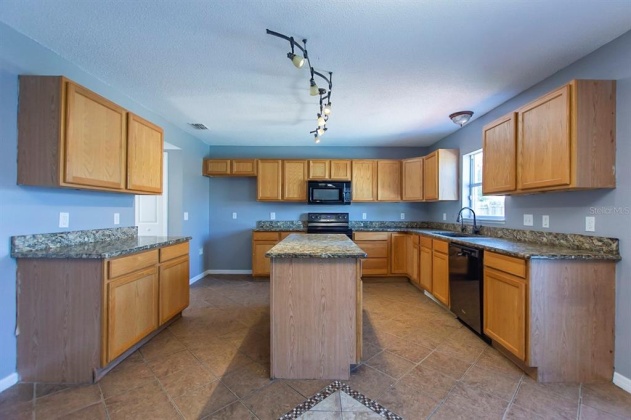 5821 WINDRIDGE DRIVE, WINTER HAVEN, Florida 33881, 5 Bedrooms Bedrooms, ,3 BathroomsBathrooms,Residential,For Sale,WINDRIDGE,O6007783