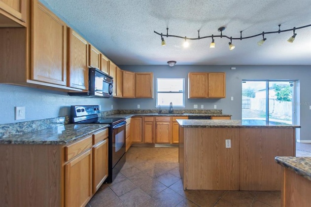 5821 WINDRIDGE DRIVE, WINTER HAVEN, Florida 33881, 5 Bedrooms Bedrooms, ,3 BathroomsBathrooms,Residential,For Sale,WINDRIDGE,O6007783